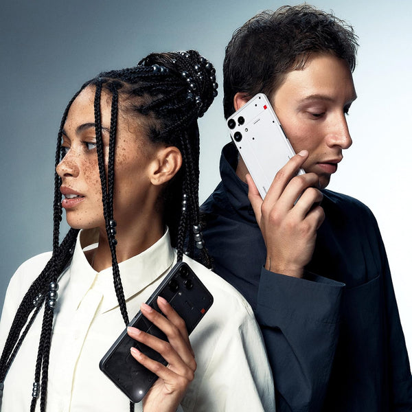 Two people using the Nothing Phone (3a) Lite in Black, showing its distinctive design in an everyday lifestyle setting