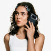 Woman using the Black Nothing Phone (4a) 5G during a voice call, demonstrating the smartphone’s comfortable design and everyday communication experience.
