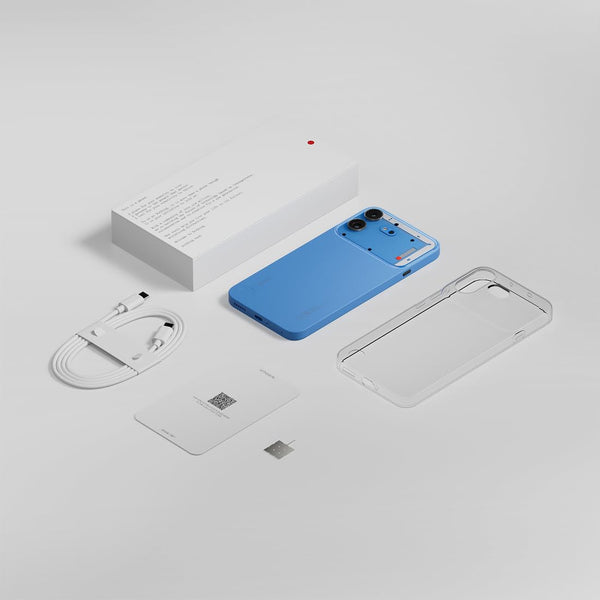 Nothing Phone (4b) 5G box contents displayed in an exploded layout with the White smartphone, retail packaging and included accessories