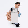 Person holding the Nothing Phone (4b) 5G in White, showing its front display, dual rear cameras and soft-touch body in a lifestyle setting